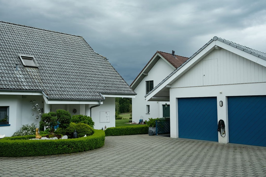 Portes de garage sectionnelles, enroulables et latérales